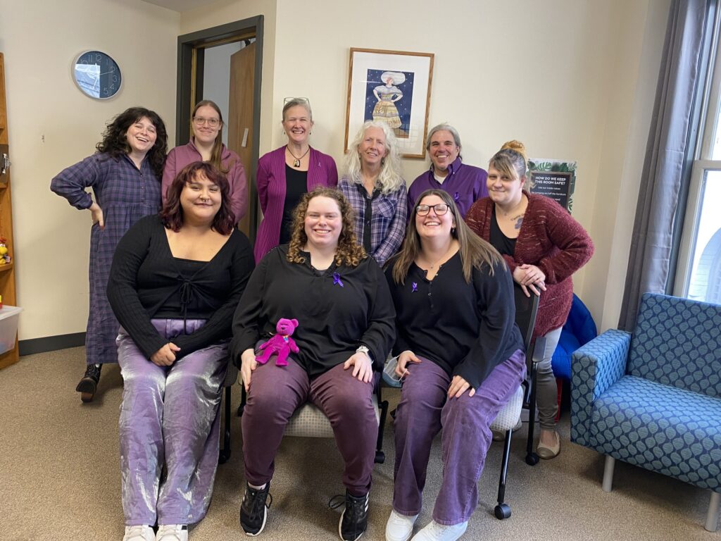 The Advocacy Center Staff in purple to acknowledge survivors of domestic violence.